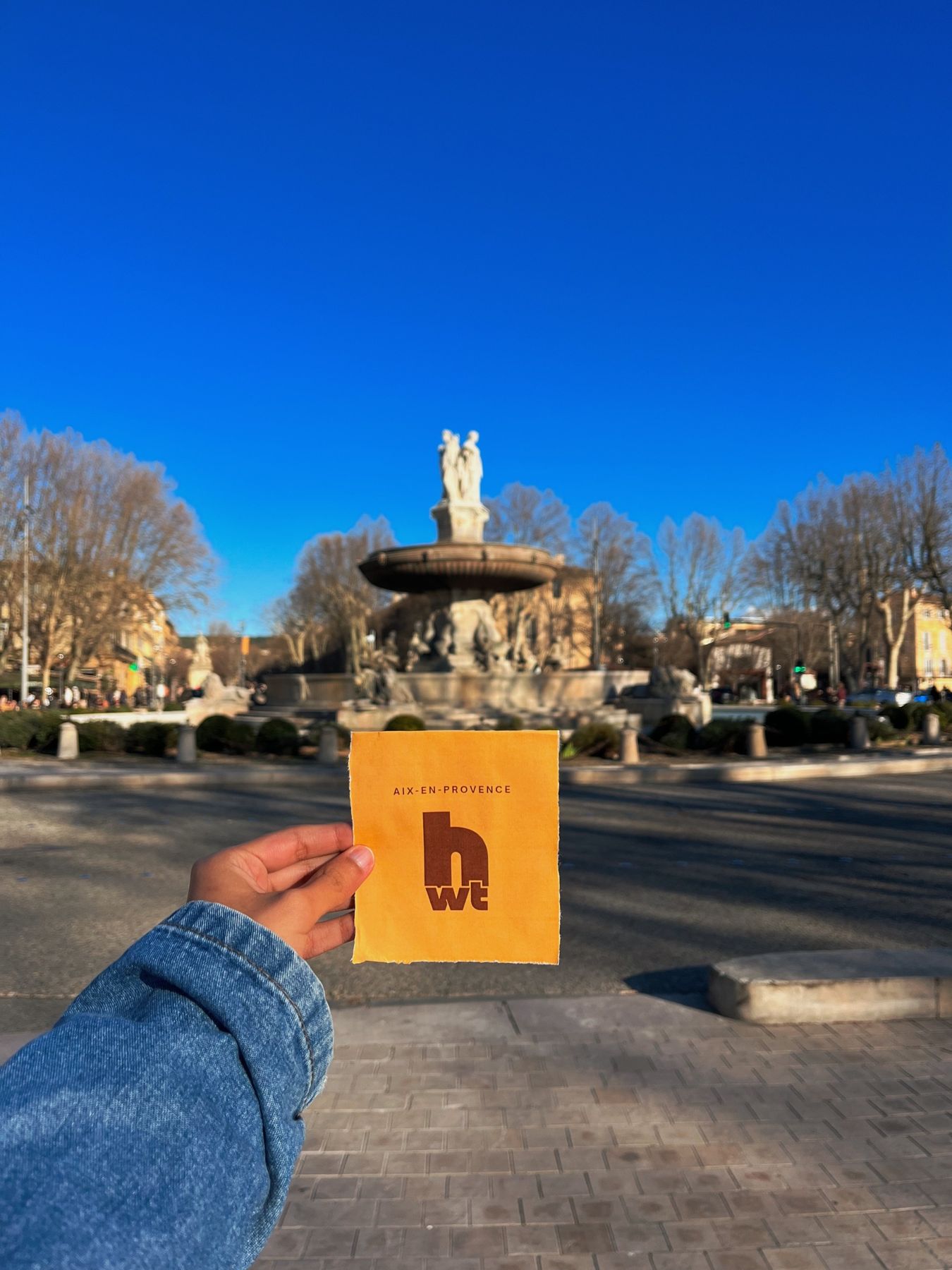 Holding the Happy Walking Tour sign at La Rotonde